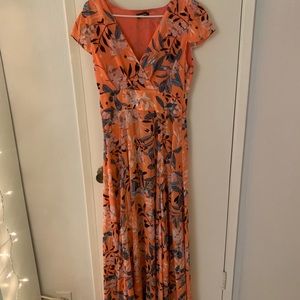 Beautiful Bebe orange dress with flower print.